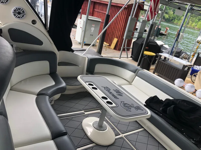 Slide: The Image of Interior of 1999 Sea Ray 460 Sundancer yacht with seating and table. - 9