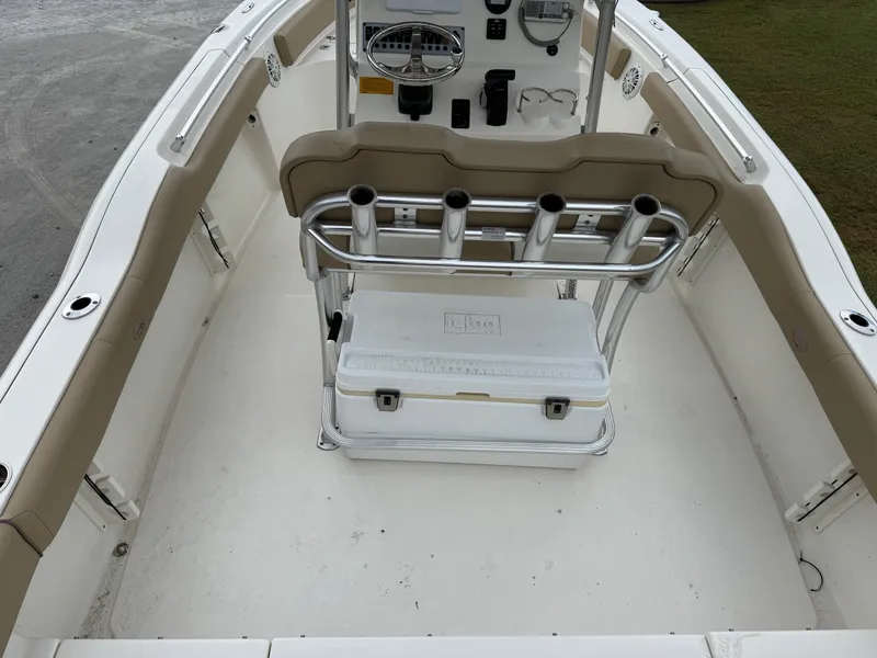 Slide: The Image of 2019 Key West 219 FS boat interior with rod holders and cooler. - 13