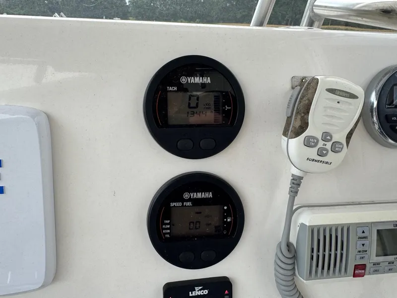 Slide: The Image of Control panel of a 2019 Key West 219 FS boat with Yamaha gauges and Uniden radio. - 14