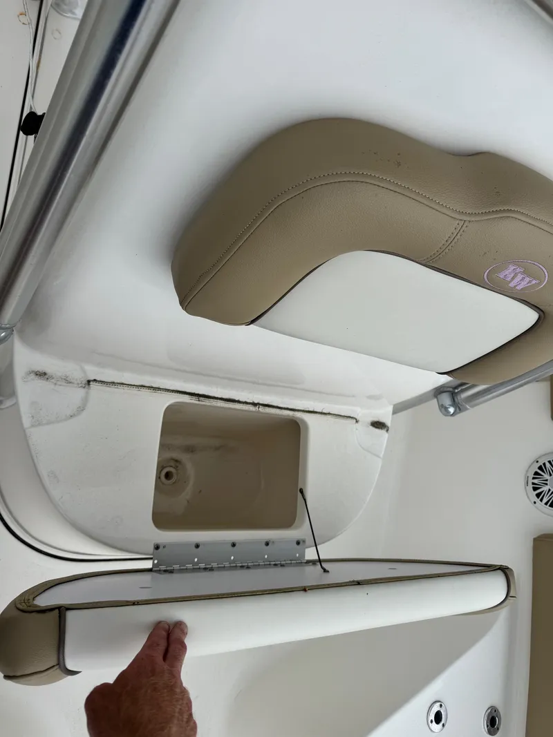 Slide: The Image of 2019 Key West 219 FS boat seat with storage compartment open. - 18
