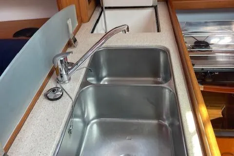 Slide: The Image of Kitchen sink area in a 2004 Wauquiez Centurion 40s yacht. - 11