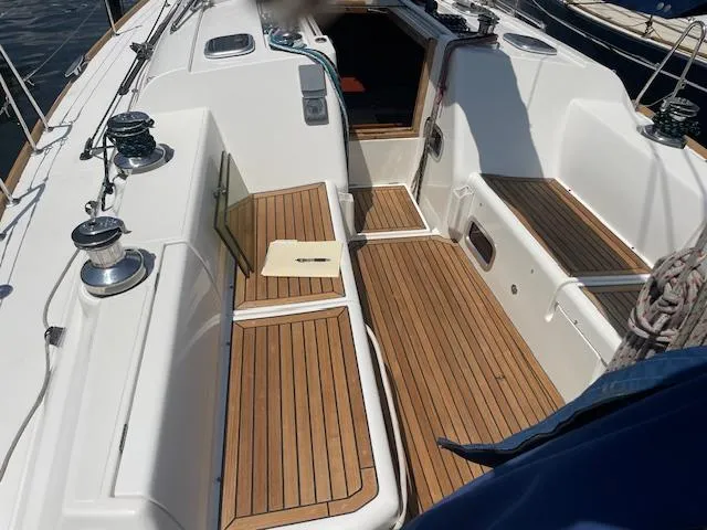 Slide: The Image of 2004 Wauquiez Centurion 40s sailboat cockpit with teak flooring and winches. - 12
