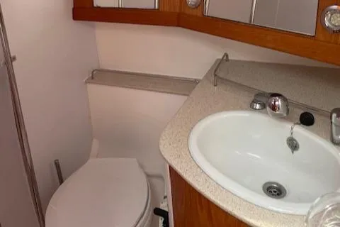 Slide: The Image of Bathroom interior of 2004 Wauquiez Centurion 40s yacht with sink and toilet. - 16
