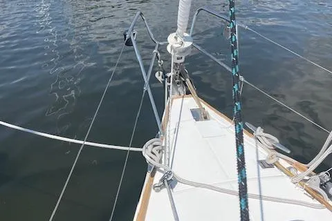 Slide: The Image of Bow of 2004 Wauquiez Centurion 40s sailboat on calm water. - 24