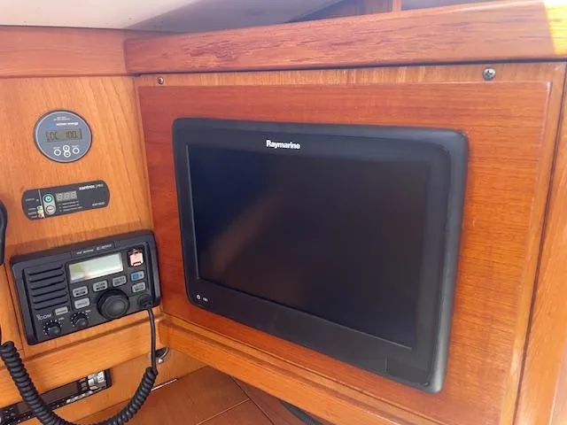 Slide: The Image of Navigation equipment on 2004 Wauquiez Centurion 40s yacht, featuring Raymarine display and communication devices. - 7