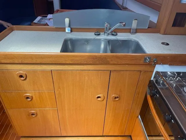 Slide: The Image of Wooden yacht kitchen with double sink, Wauquiez Centurion 40s, 2004 model. - 9