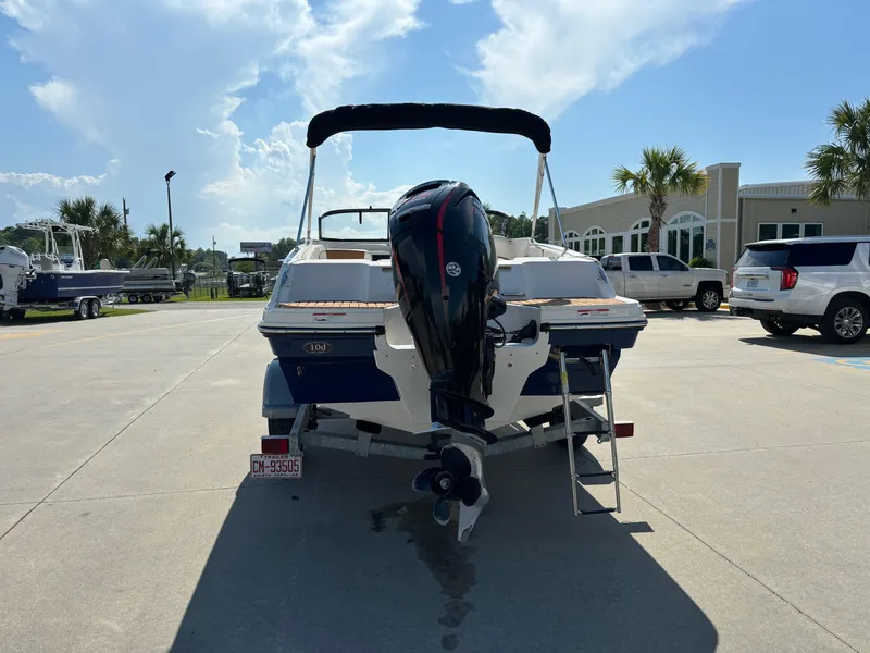 Slide: The Image of 2021 Bayliner VR4 Bowrider OB boat with outboard motor in a sunny marina. - 3