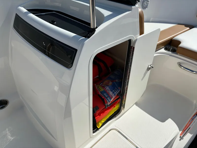 Slide: The Image of 2021 Bayliner VR4 Bowrider OB storage compartment with life jackets and supplies. - 9