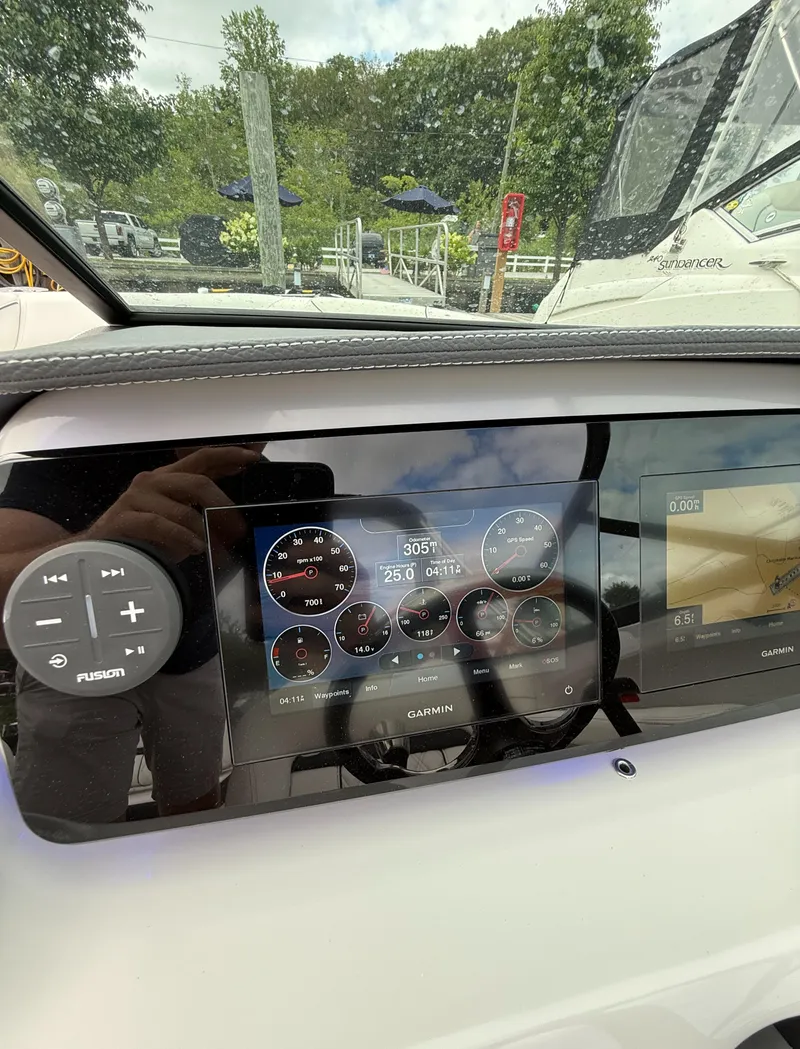 Slide: The Image of Dashboard of 2022 Regal LX2 boat with Garmin display and Fusion controls. - 22