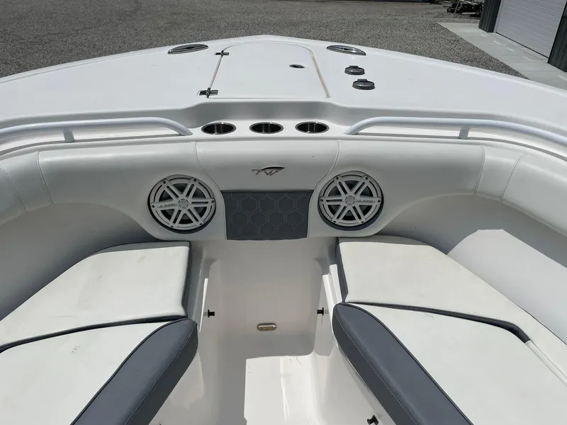 Slide: The Image of 2020 Tidewater 280 CC Adventure Custom boat interior with seating and speakers. - 10
