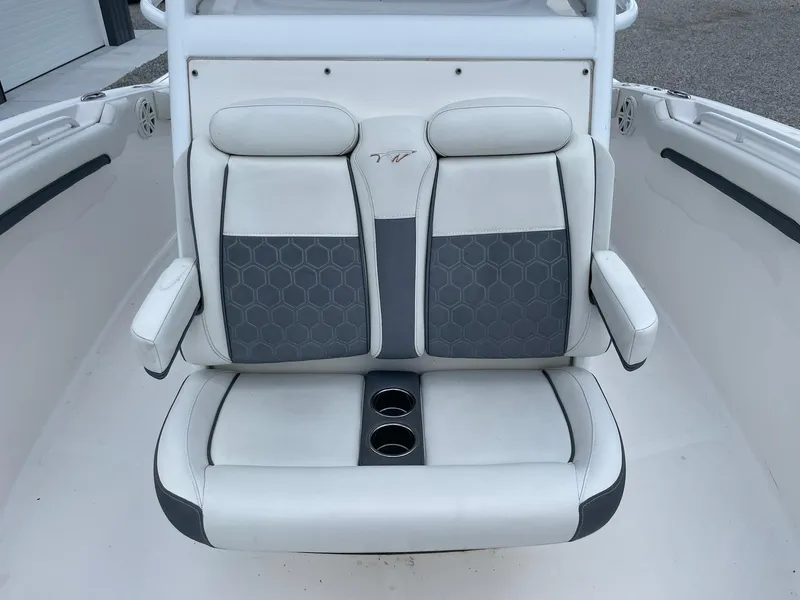 Slide: The Image of Luxury seating on 2020 Tidewater 280 CC Adventure Custom boat, featuring dual cup holders. - 13