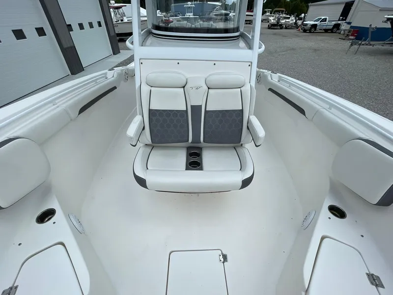 Slide: The Image of 2020 Tidewater 280 CC Adventure Custom boat interior with cushioned seating and cup holders. - 14