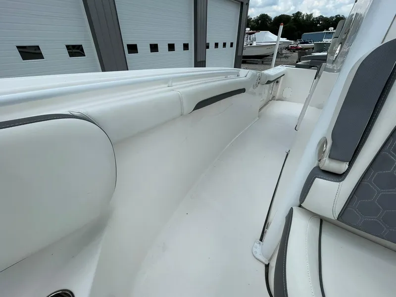 Slide: The Image of 2020 Tidewater 280 CC Adventure Custom boat interior with white seating and gray accents. - 17