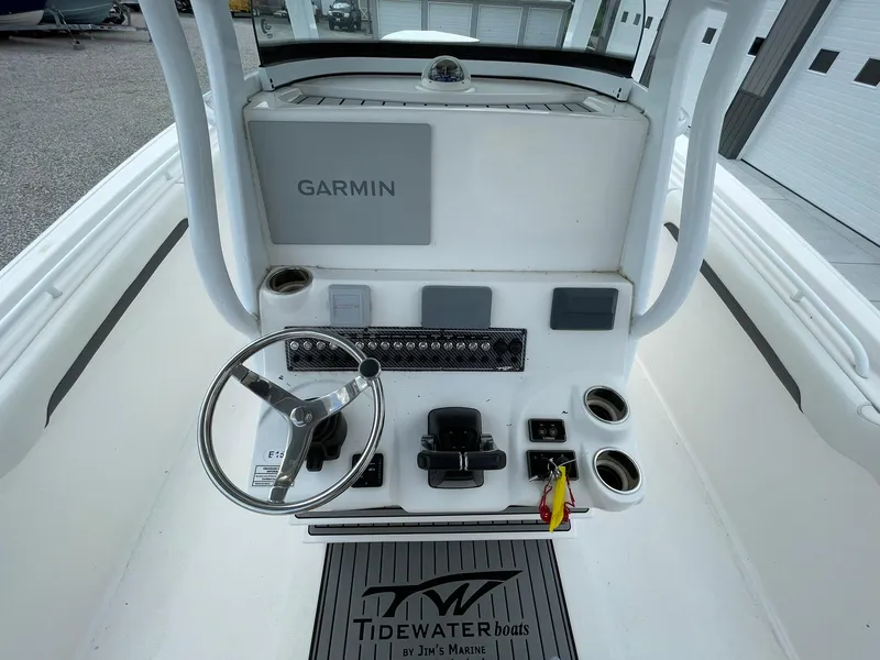 Slide: The Image of 2020 Tidewater 280 CC Adventure Custom boat helm with Garmin display and steering wheel. - 22