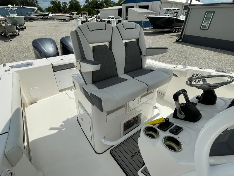 Slide: The Image of Tidewater 280 CC Adventure Custom 2020 boat interior with dual seats and steering console. - 30