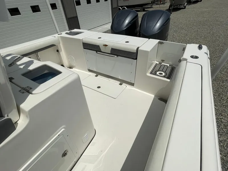 Slide: The Image of 2020 Tidewater 280 CC Adventure Custom boat deck with dual engines and storage compartments. - 31