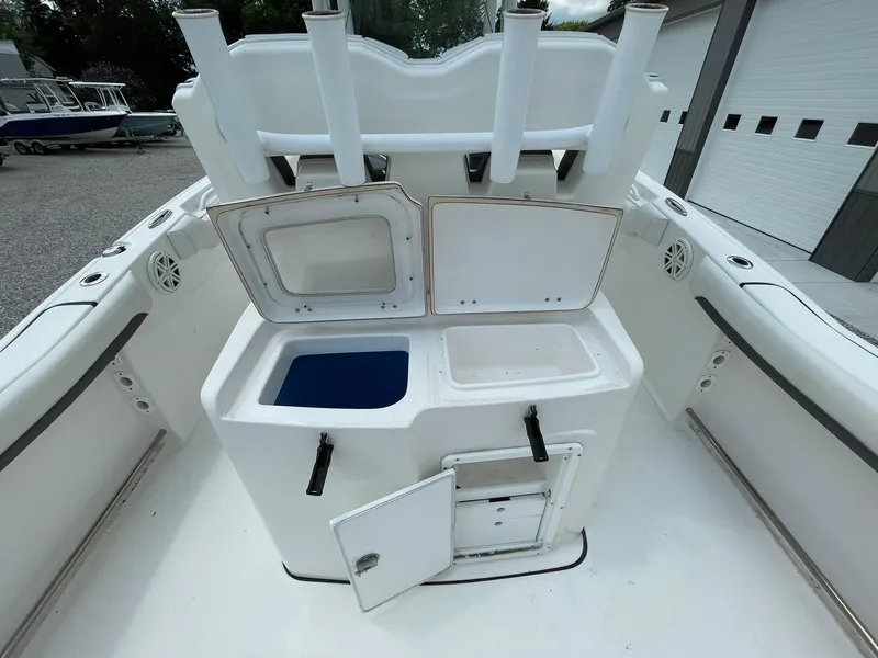 Slide: The Image of 2020 Tidewater 280 CC Adventure Custom boat with open storage compartments and rod holders. - 32