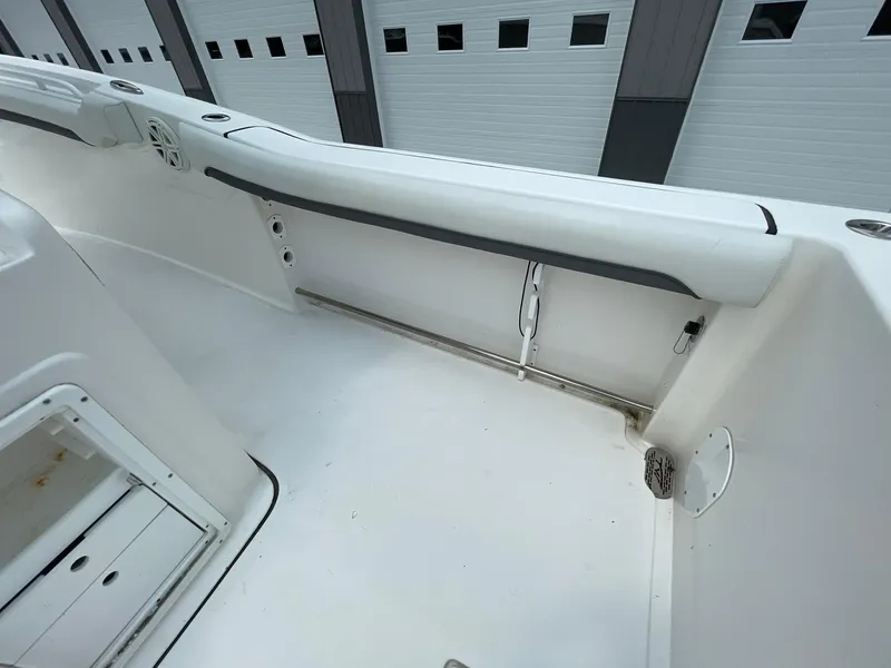 Slide: The Image of 2020 Tidewater 280 CC Adventure Custom boat interior with white seating and storage compartments. - 34