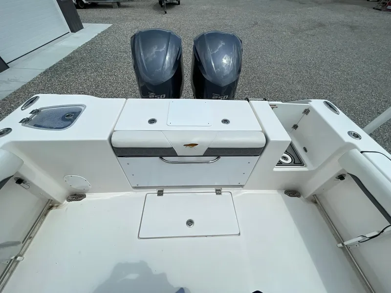 Slide: The Image of 2020 Tidewater 280 CC Adventure Custom boat with dual outboard motors, rear deck view. - 39