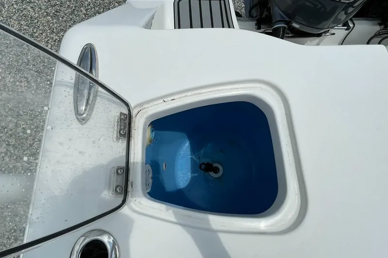 Slide: The Image of Open hatch on 2020 Tidewater 280 CC Adventure Custom boat, showing interior compartment. - 40