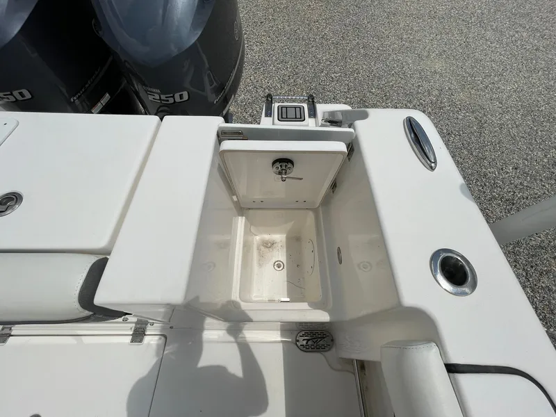 Slide: The Image of 2020 Tidewater 280 CC Adventure Custom boat with open storage compartment and dual engines. - 43