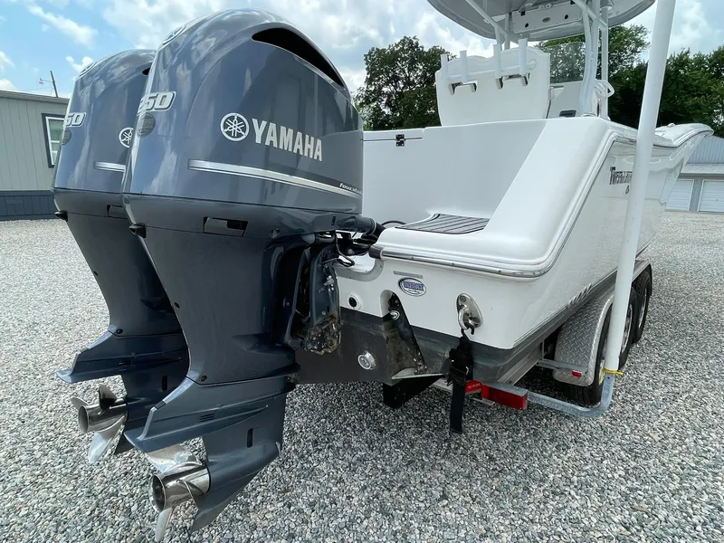 Slide: The Image of 2020 Tidewater 280 CC Adventure Custom boat with dual Yamaha engines on a trailer. - 48