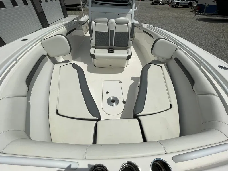 Slide: The Image of 2020 Tidewater 280 CC Adventure Custom boat interior with cushioned seating and storage. - 7
