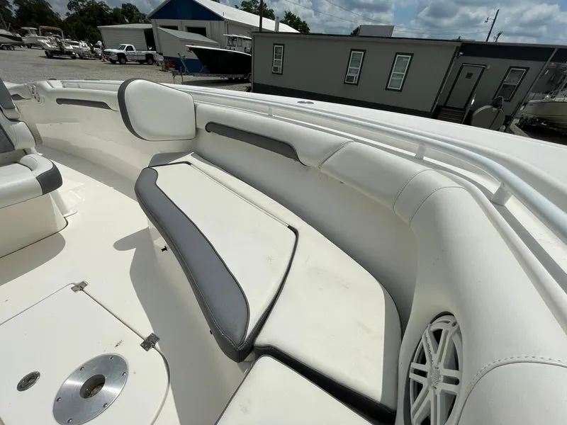 Slide: The Image of 2020 Tidewater 280 CC Adventure Custom boat interior with cushioned seating and speaker. - 9