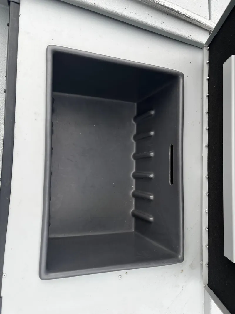 Slide: The Image of Empty storage compartment in a 2021 Ranger RT178 boat. - 10