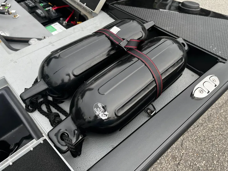 Slide: The Image of 2021 Ranger RT178 boat storage with black fenders and battery compartment. - 15