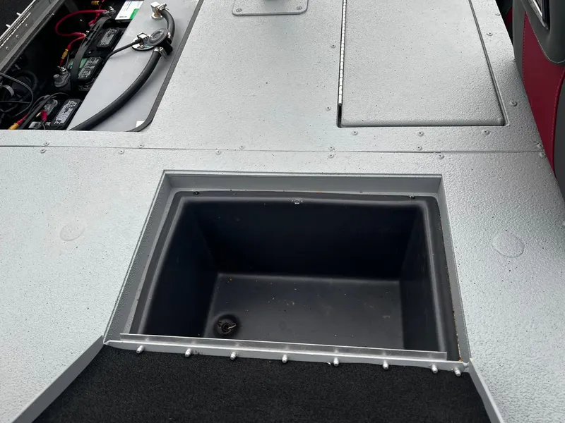 Slide: The Image of 2021 Ranger RT178 boat storage compartment and battery area. - 16