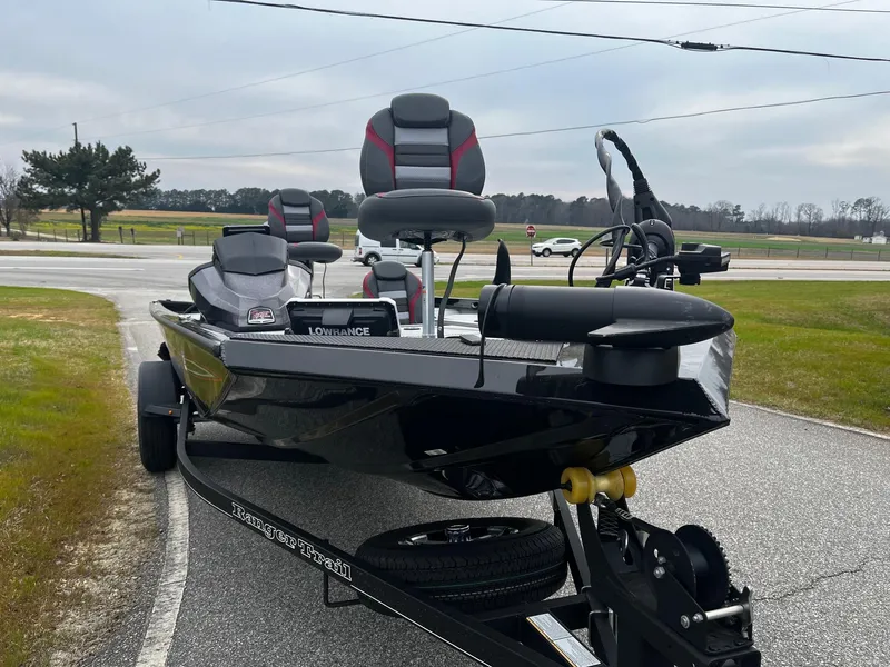 Slide: The Image of 2021 Ranger RT178 boat on trailer, featuring Lowrance equipment, parked near a road. - 5
