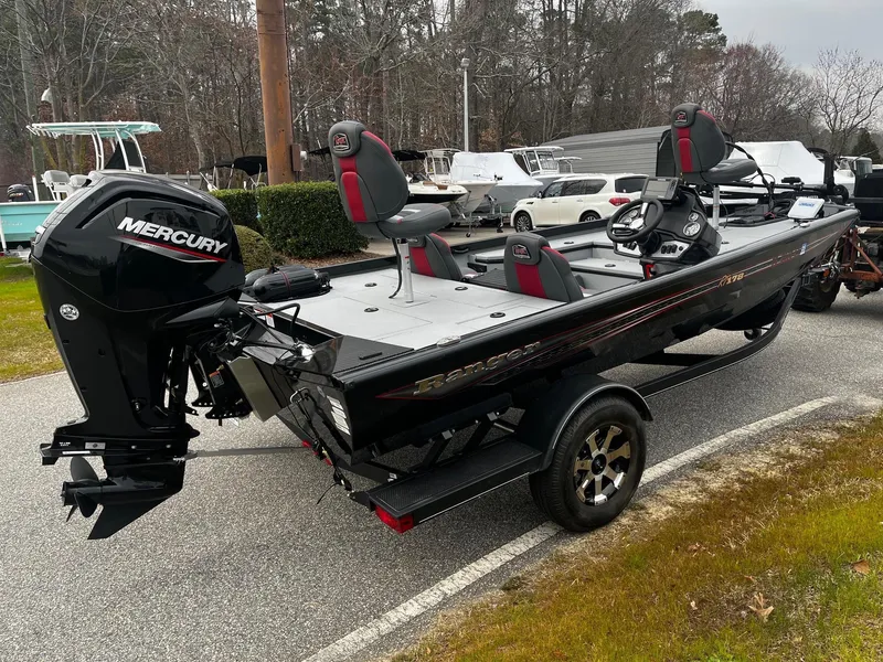 Slide: The Image of 2021 Ranger RT178 boat with Mercury engine, parked outdoors on a trailer. - 6