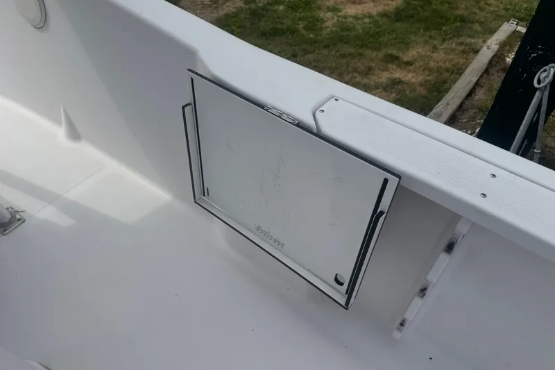 Slide: The Image of 2002 Pro-Line 20 Sport boat interior with storage compartment, white finish. - 11