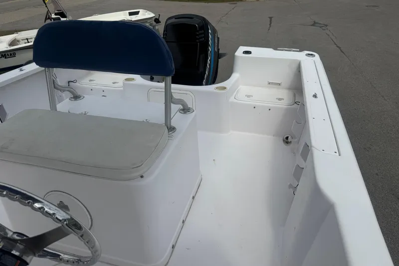 Slide: The Image of 2002 Pro-Line 20 Sport boat interior with seating and outboard motor. - 13
