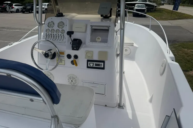 Slide: The Image of 2002 Pro-Line 20 Sport boat interior with steering wheel and control panel. - 16