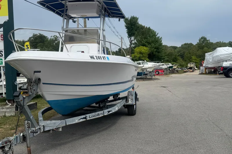Slide: The Image of 2002 Pro-Line 20 Sport boat on trailer in outdoor storage area. - 2