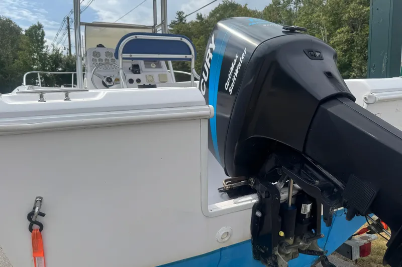 Slide: The Image of 2002 Pro-Line 20 Sport boat with Mercury Optimax Saltwater engine, rear view. - 3