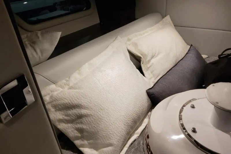 Slide: The Image of Interior cabin of 2026 Formula 380 Super Sport Crossover OB with pillows and seating. - 105