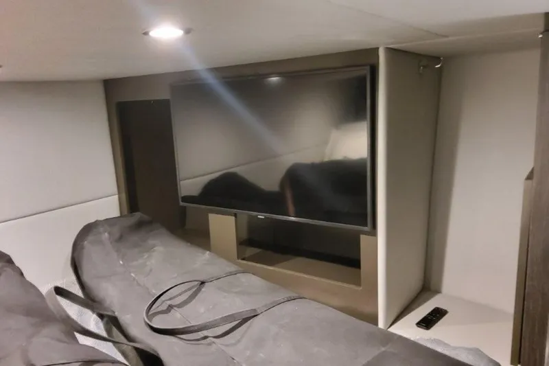 Slide: The Image of Interior of 2026 Formula 380 Super Sport Crossover OB with TV and storage bags. - 108