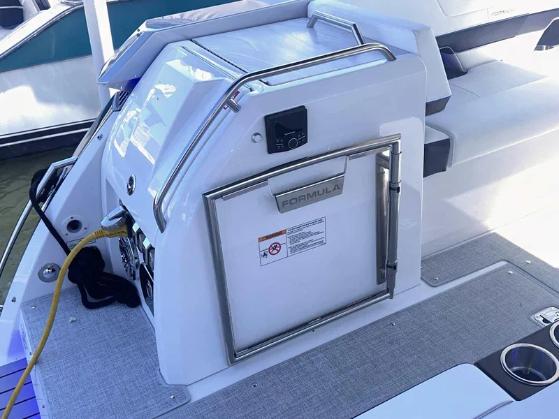 Slide: The Image of 2026 Formula 380 Super Sport Crossover OB with dual 600 V12 engines in a workshop. - 11