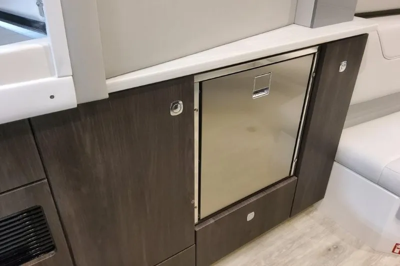 Slide: The Image of 2026 Formula 380 Super Sport Crossover OB interior with sleek cabinetry and stainless steel accents. - 111