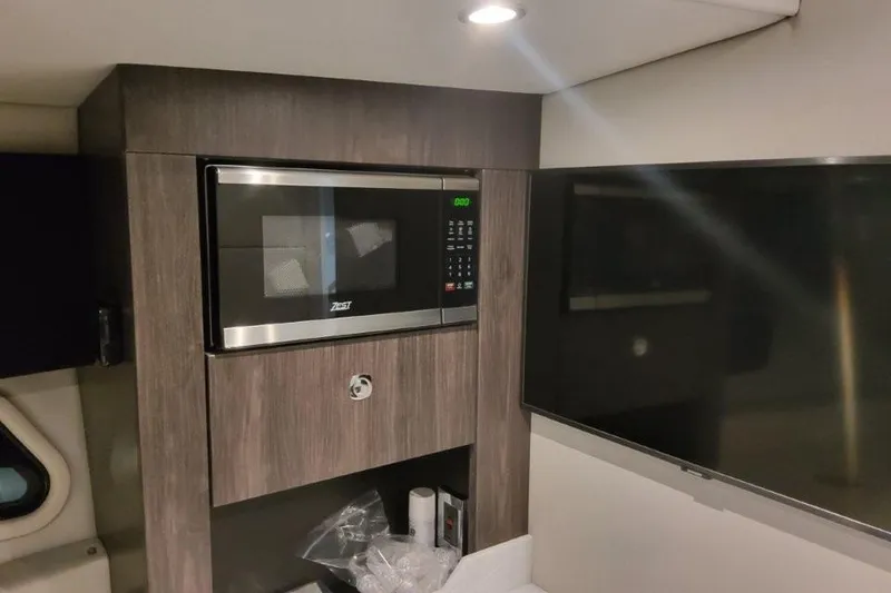 Slide: The Image of Interior of 2026 Formula 380 Super Sport Crossover OB with microwave and TV. - 117