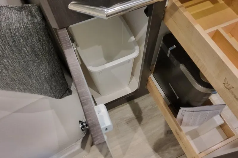 Slide: The Image of Interior storage of 2026 Formula 380 Super Sport Crossover OB with trash bin and compartments. - 121