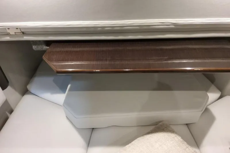 Slide: The Image of Interior of 2026 Formula 380 Super Sport Crossover OB with white seating and wooden table. - 122