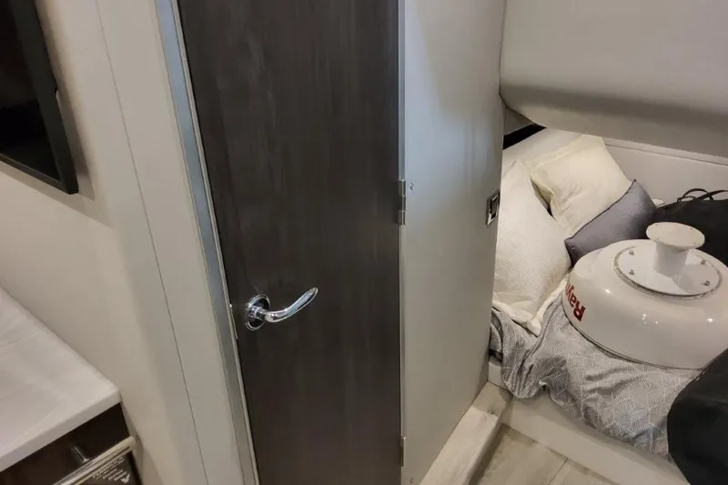 Slide: The Image of Interior cabin of 2026 Formula 380 Super Sport Crossover OB, featuring a cozy bed and modern design. - 123