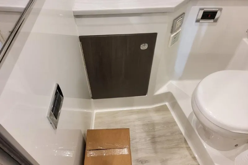 Slide: The Image of Interior of 2026 Formula 380 Super Sport Crossover OB, featuring a compact bathroom space. - 124