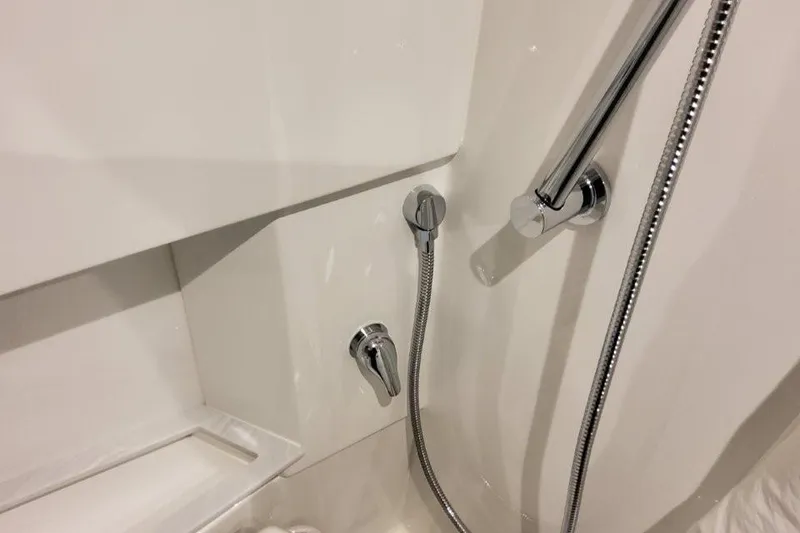 Slide: The Image of Shower controls and hose in 2026 Formula 380 Super Sport Crossover OB boat. - 132