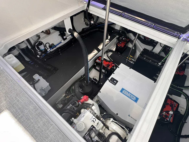 Slide: The Image of 2026 Formula 380 Super Sport Crossover OB with Mercury outboard engines in a showroom. - 20