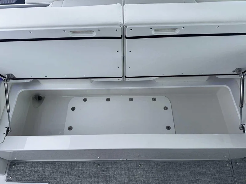 Slide: The Image of 2026 Formula 380 Super Sport Crossover OB storage compartment with cables and generator switch. - 24